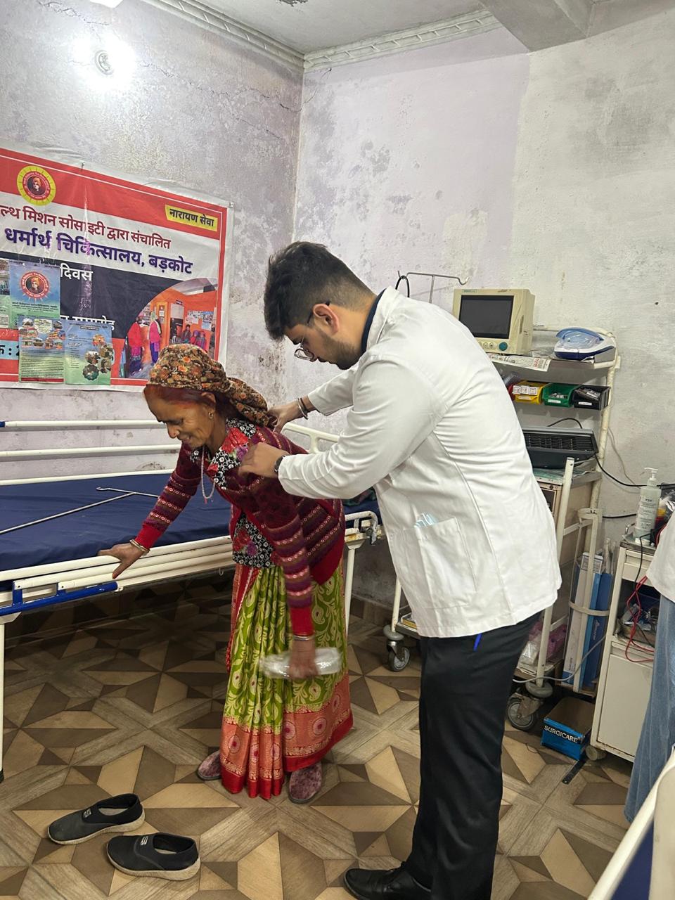 Dr. Saiyam Narula assisting a patient with balance and gait training